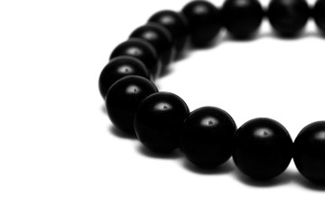 Black beads isolated on white background
