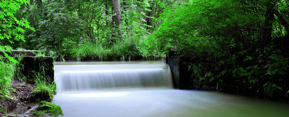 panoramic view of a waterfall in the English garden in Munich