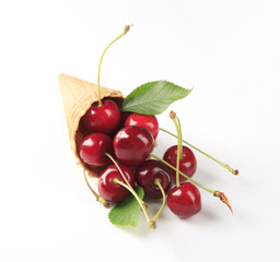 Fresh red cherries in a cone