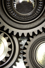 Closeup of three steel cogs
