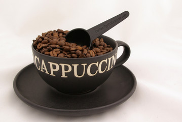 coffee beans and measuring cup