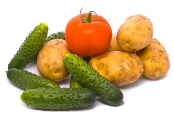 Fresh tomato, cucumbers and potatoes on studio white