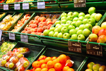 various fruits in the supermarket on shelves