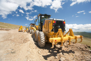 Excavator, digger, earthmover at construction site