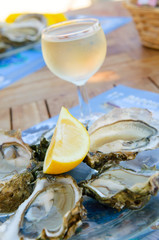 fresh oysters and a glass of wine © javarman