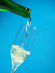 Pouring white wine from a bottle