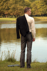 Fototapeta premium man with jacket at the shore