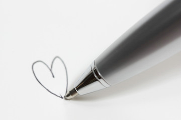 Pen drawing heart isolated on white