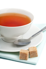 cup of tea and cane sugar isolated