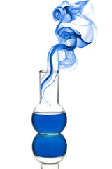 chemical flask with blue liquid and smoke isolated