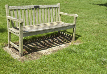 Old Park Bench in the middle of the field