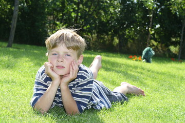 Boy lying on Grass