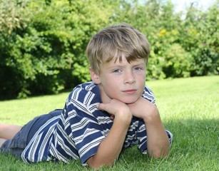 Boy lying on Grass