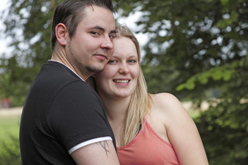 Fototapeta premium Young couple hugging one another