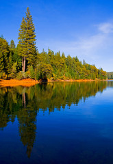 Reflection in clear blue lake in Northern California