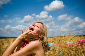 Young happy woman in field