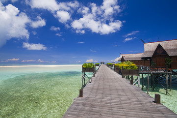 Walkway to tropical island resort