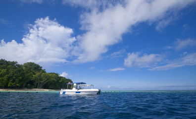 Fototapeta na wymiar Divers boat on crystal clear water