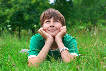 boy relaxing on grass