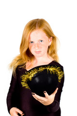 girl is wearing a black hat with golden streamer