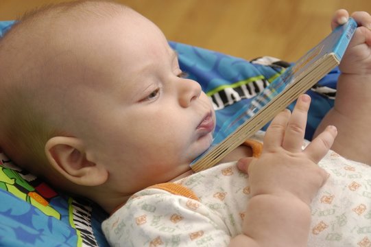 Baby boy with book