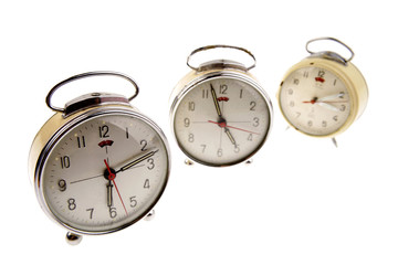 Retro alarm clocks on white background