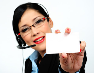 businesswoman showing a business card (focus on the card)
