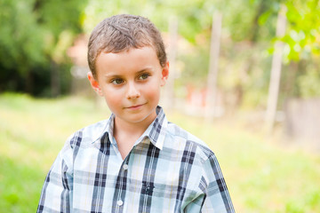 Cute kid outdoors in a grass field