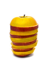 Sliced yellow and red apples on studio white