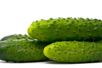 Fresh cucumbers on studio white