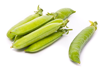 Pods of fresh green peas on a white background