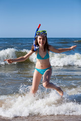 Girl playing on beach