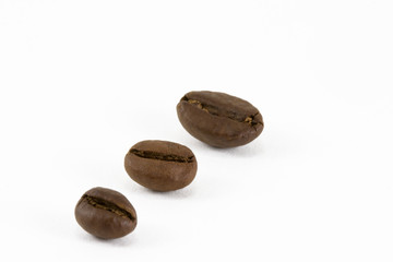 Fototapeta premium Three coffee beans