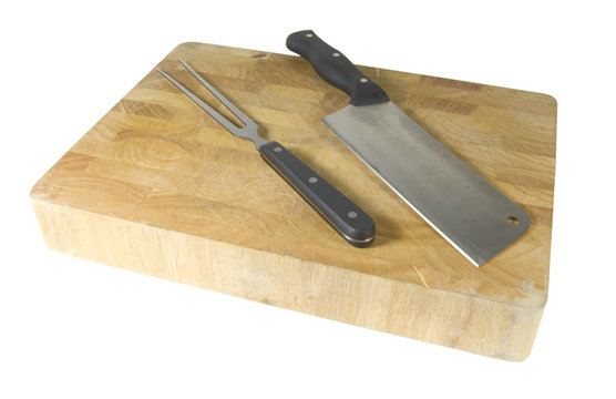 meat cleaver and fork on chopping board isolated on white