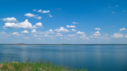 quiet water of lake and cloudy sky