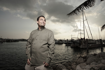 Man at a marina during sunset