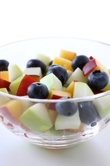 Fresh fruit salad with blueberries, apples and peaches