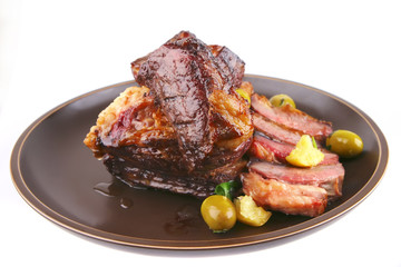 ribs on old style ceramic dish over white
