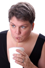 Beautiful Woman Drinking From a Straw