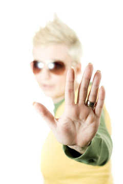 Young woman making a stop hand gesture