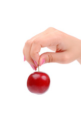 The female hand holds one plum