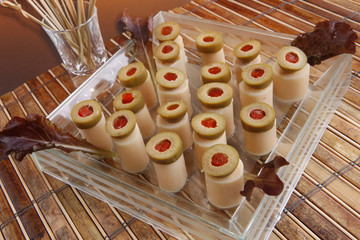Hearts of palm canapes topped with stuffed olives