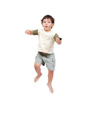 Happy little child in white clothes is jumping isolated