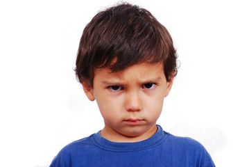 Cute kid with angry expression on his face