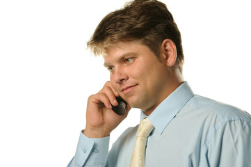 The businessman talking by a mobile phone