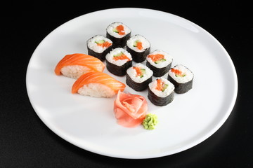 Set of sushi and rolls with a salmon