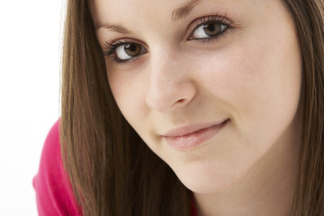 Obraz premium Studio Portrait Of Smiling Teenage Girl