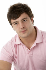 Studio Portrait Of Smiling Teenage Boy