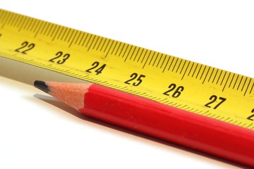 Measuring tape and red marking pencil