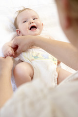 Mother Changing Baby Nappy